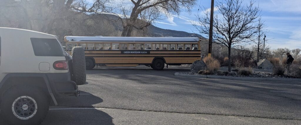 A schoolbus in a parking lot