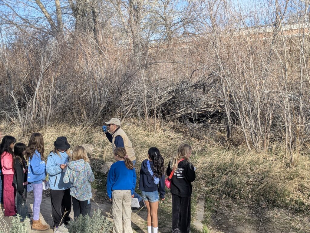 Students in a line by the river